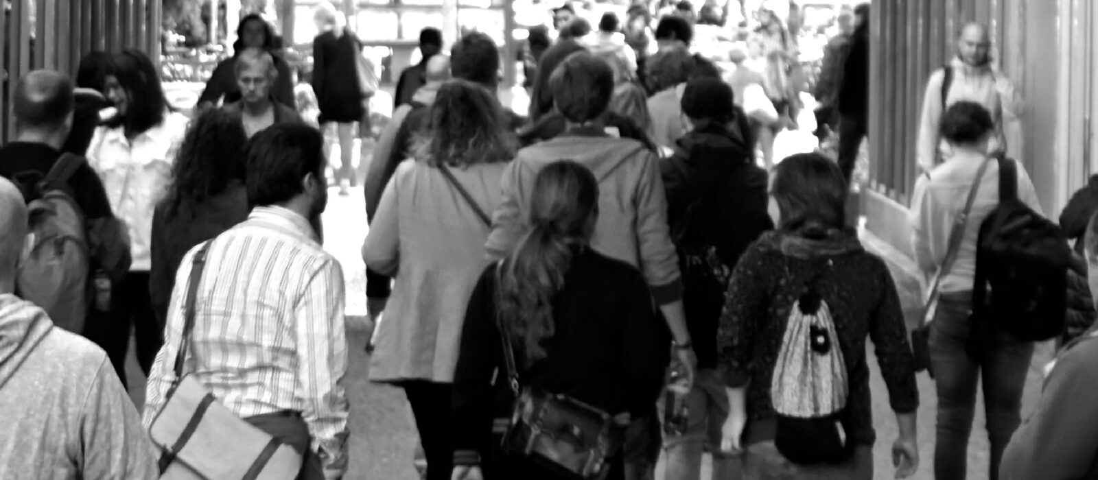 Commuters walking along high street